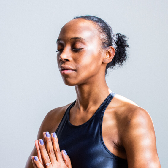 Brown woman in yoga pose